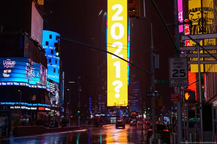 A photo of Times Square with sign reading "2021?"